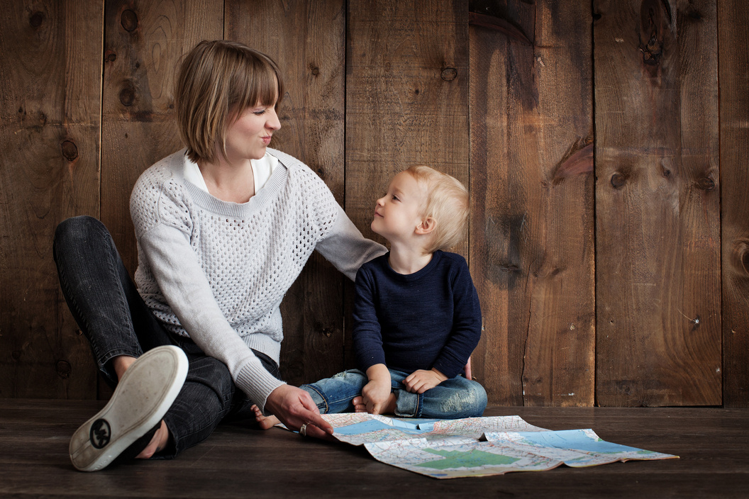 Mother and Child Holding a Map